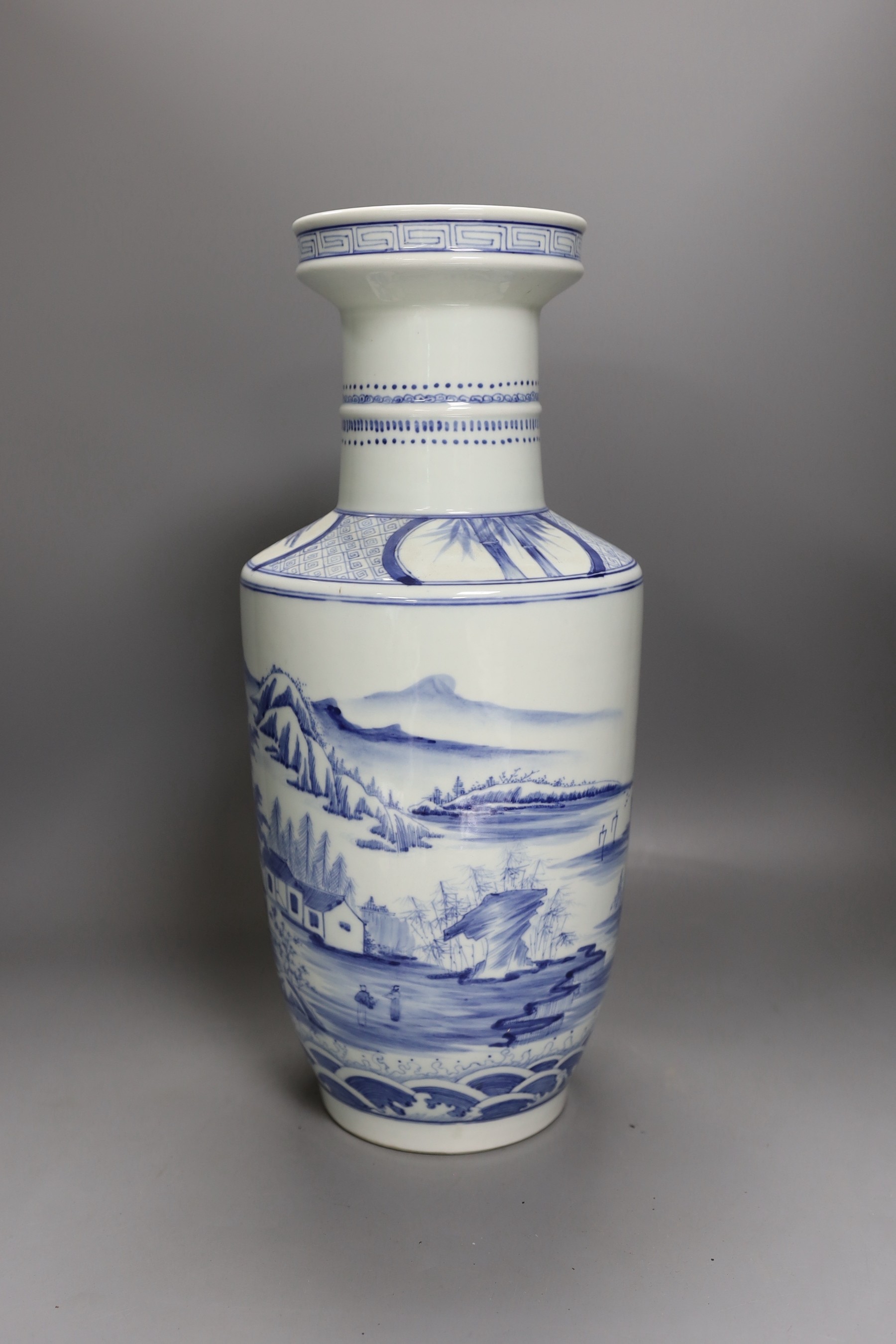 A Chinese blue and white rouleau vase, Kangxi mark but later 40cm